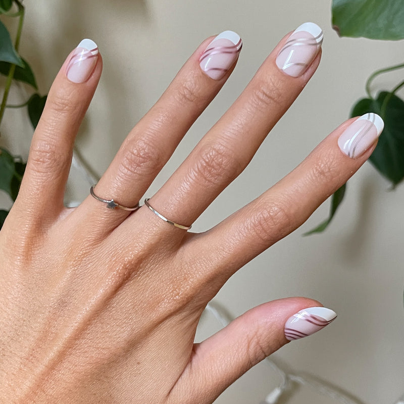 Metallic Linear French - Press-On | Short | Round short false nails with white tips and fine metallic line details on natural nails