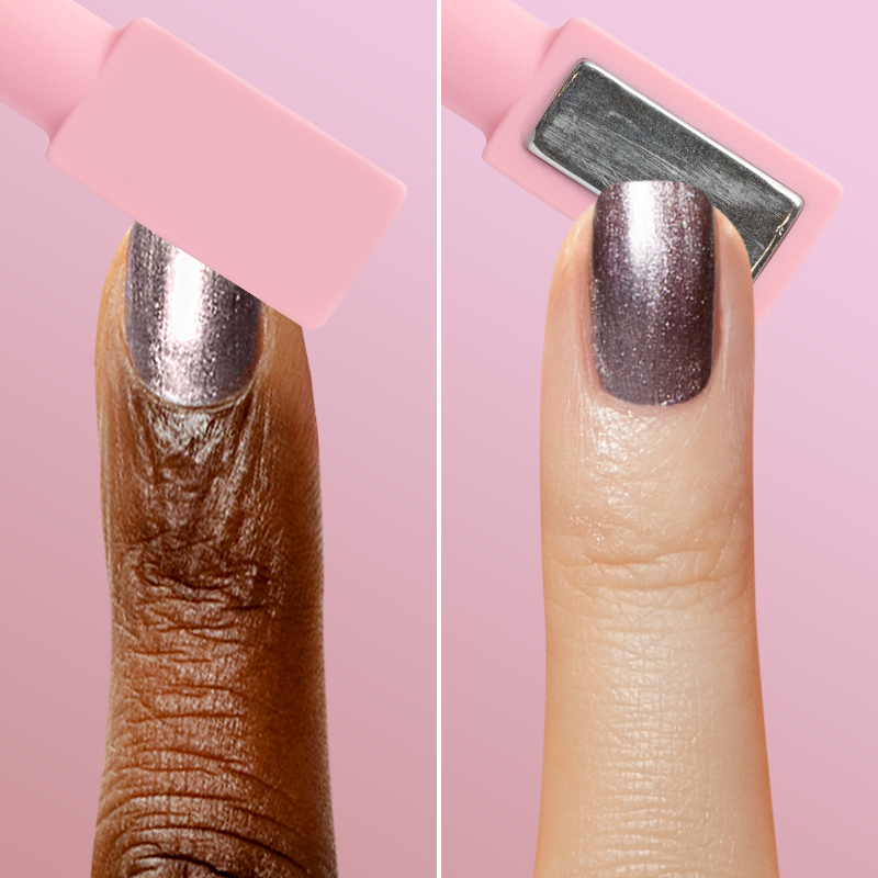 Two fingers with metallic polish and pink magnetic wand demonstrating effect from Magnetic Polish Set manicure tools