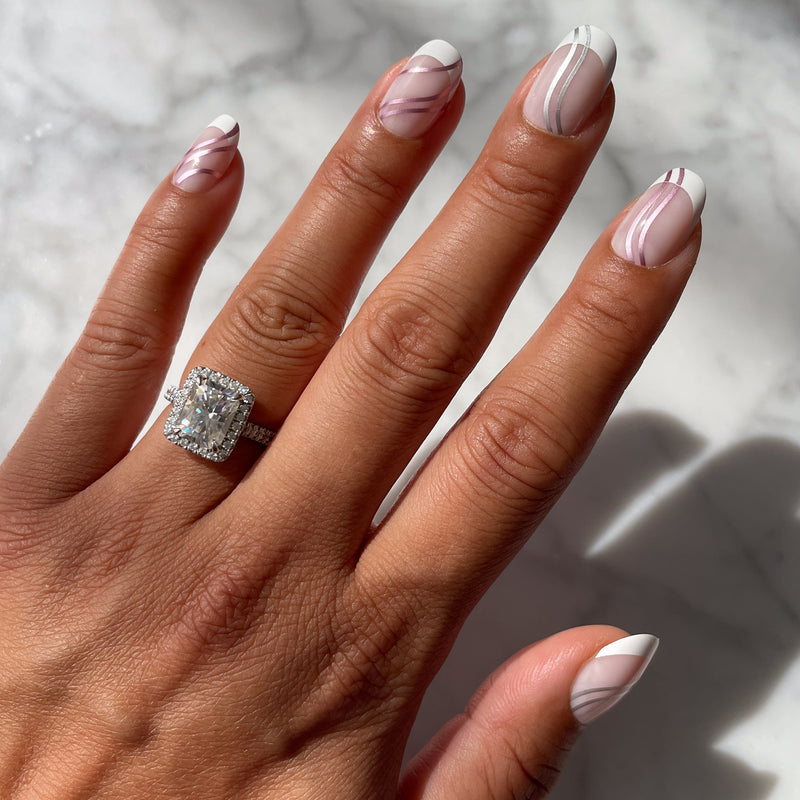 Metallic Linear French - Press-On | Short | Round false nails with white tips and curved metallic lines on natural hand with ring