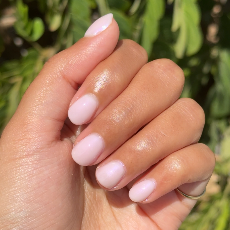 Kiss of Chrome quick dry polish with pearly sheer finish on natural nails for a glossy at-home manicure