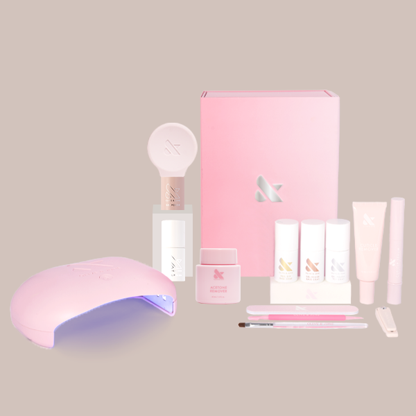 Soap Nails Gel System kit with pink LED lamp, gel polish shades, remover, nail tools, and brushes for at-home manicure