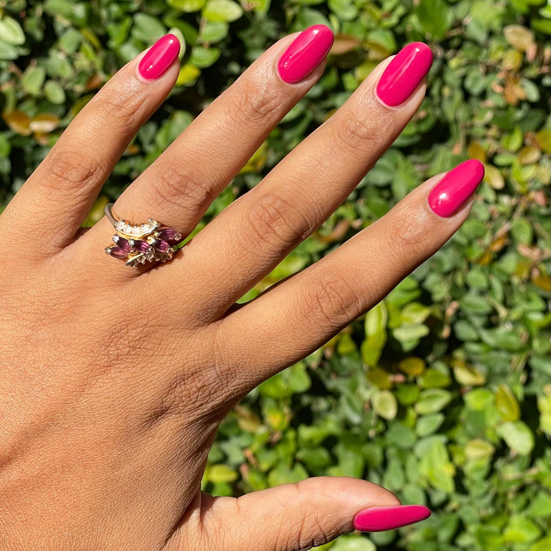 JG - Gel on almond-shaped nails in a vibrant rich berry shade for a striking and durable manicure by Olive and June