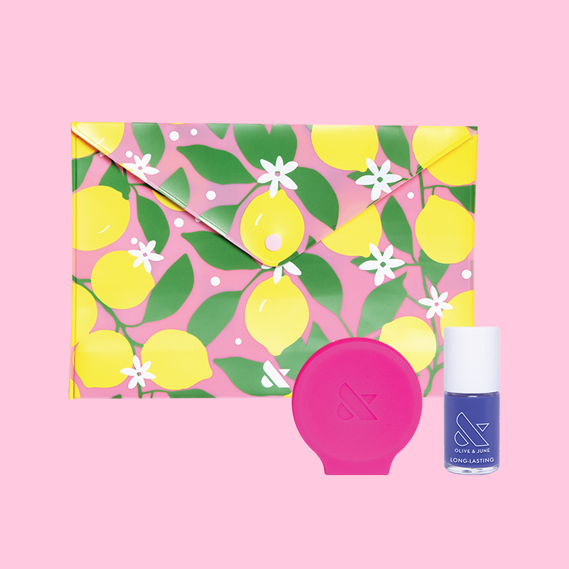 Throwback to Paradiso Set featuring a lemon print pouch, purple long-lasting polish, and pink silicone nail tool for mani care