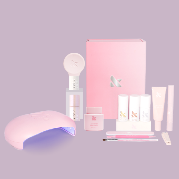The Glazed Gel Mani System with pink LED lamp, gel polishes, remover, brushes, and nail tools for at-home manicure
