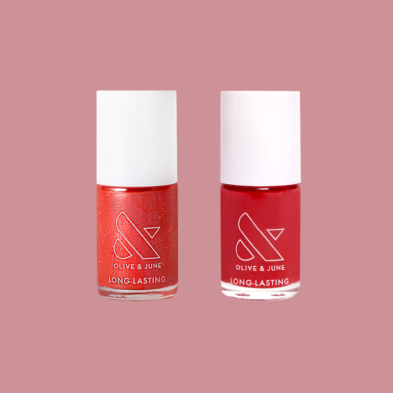 Rodeo Ruby nail polish duo with sparkling and glossy red shades in clear glass bottles for at-home mani sets