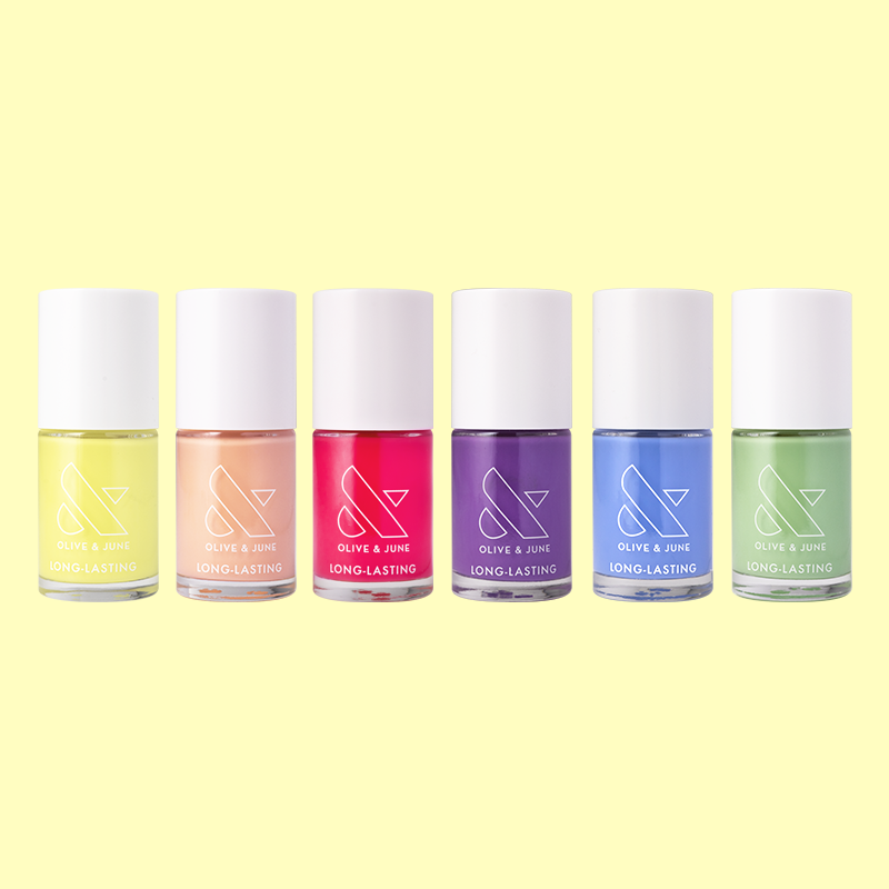 Six bottles of long-lasting nail polish in various colors from the Summer Polish Set by Olive and June.