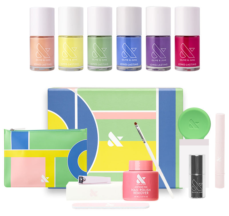System Test featuring six colorful gel polishes with manicure tools and storage bags for at home nail care.