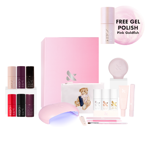Winter Bestsellers Gel System with six gel polish shades, LED lamp, manicure tools, and free Pink Goldfish polish for at-home use