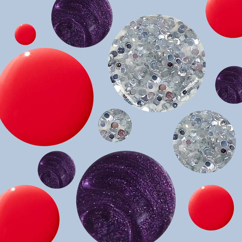 Colorful polish drops in red, shimmery purple, and sparkling silver beads from the Spicy Favorite Trio set by Olive and June