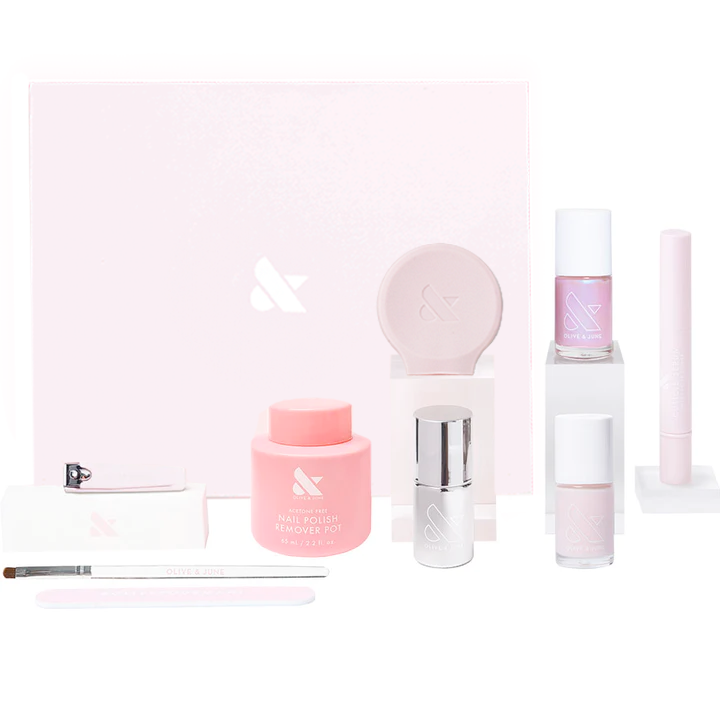 The Glazed Mani System with nail polish remover pot, cuticle serum, pink polish, clean up brush, and nail clipper set