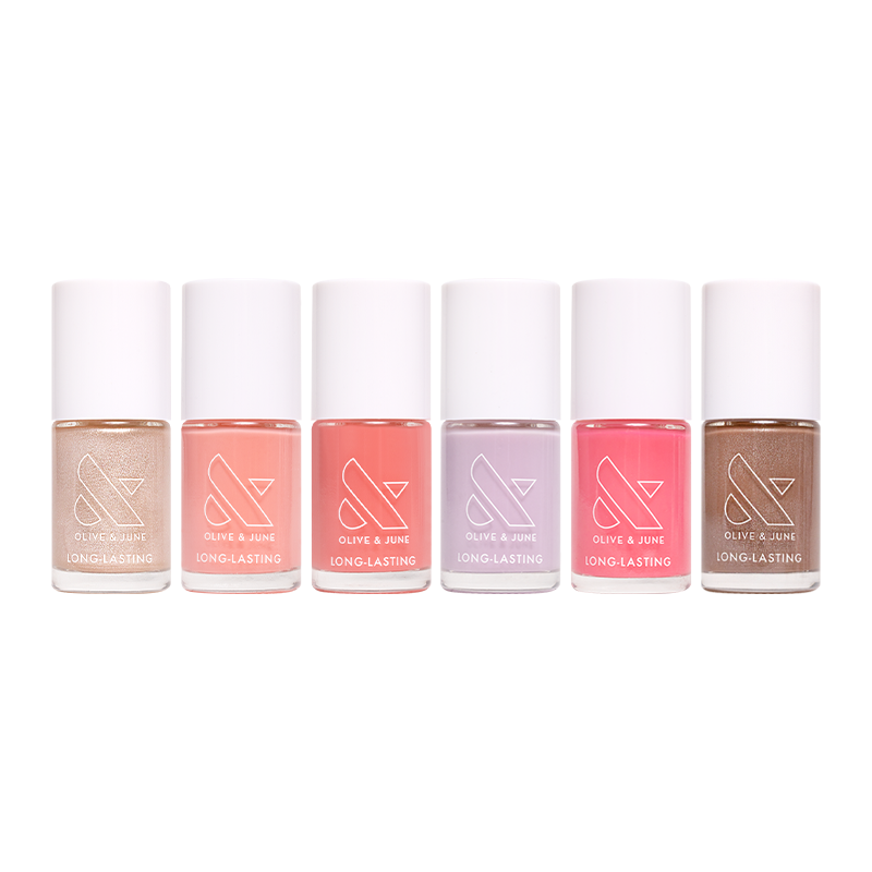 Six nail polish bottles in pastel shades from the Lip Gloss Set by Olive and June on a white background