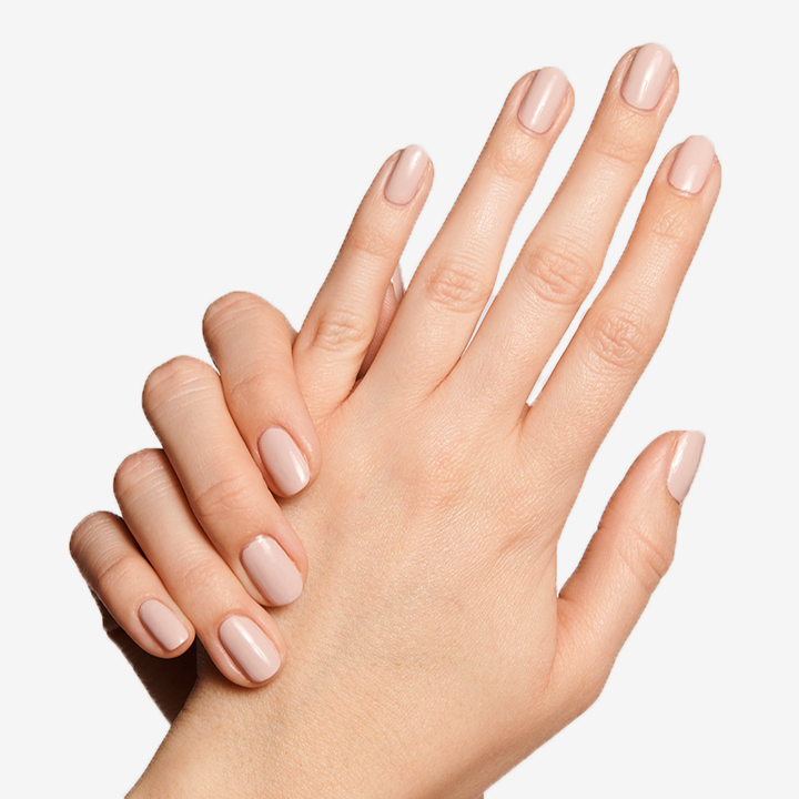 Hands with smooth nude manicure showing Long Lasting Top Coat for lasting shine and protection on nails