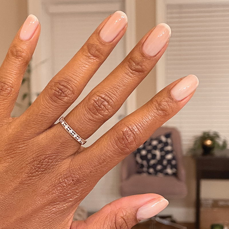 Hand showing a natural manicure with BEB sheer white gel polish for a soft and elegant mani look