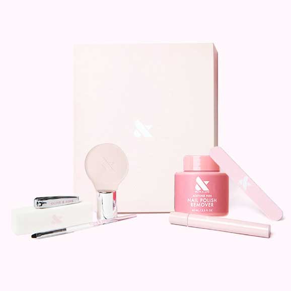 The Mani System - 6 Polishes set with remover, brush, nail file, clippers, and a white storage box for at-home mani care