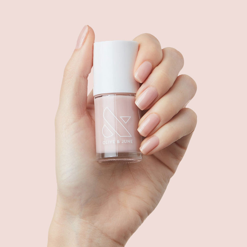 Perfect French Long-Lasting Mani System showing hand holding pale pink nail polish with matching manicure