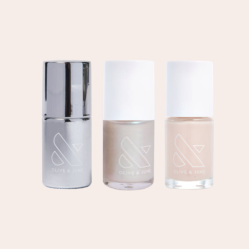 Set of three nail polishes in neutral pearlescent shades from Olive and June’s Freshwater Pearl Set for layered manicures