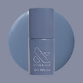 Olive and June Slate - Gel polish bottle with deep midtone slate blue gel polish swatch behind it on muted background thumbnail