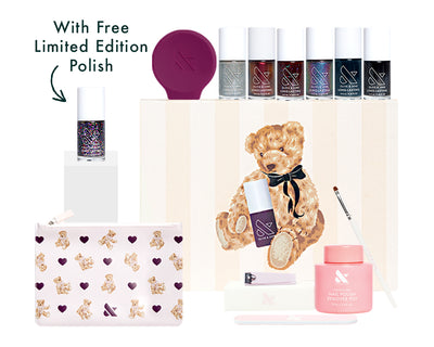 the mani system -  bright geometric patterned box with shaping and cleanup tools, remover pot top coat, and peel off base coat