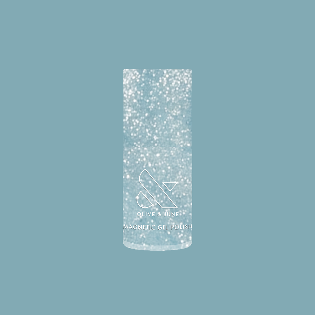 Olive and June Aqua Velvet - Gel magnetic gel polish bottle with shimmering bright pastel blue polish background