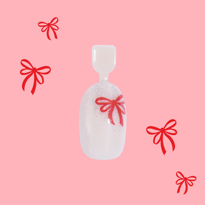 Big Bow Energy - Pressies | Short Medium | Round showing press-on nails with shimmery tips and red bow accents in kid-friendly packaging Big Bow Energy - Pressies | Short Medium | Round  Pressies