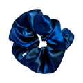 Blue Scrunchie made of shiny fabric with gathered texture, designed to keep hair back during mani and nail polish application thumbnail