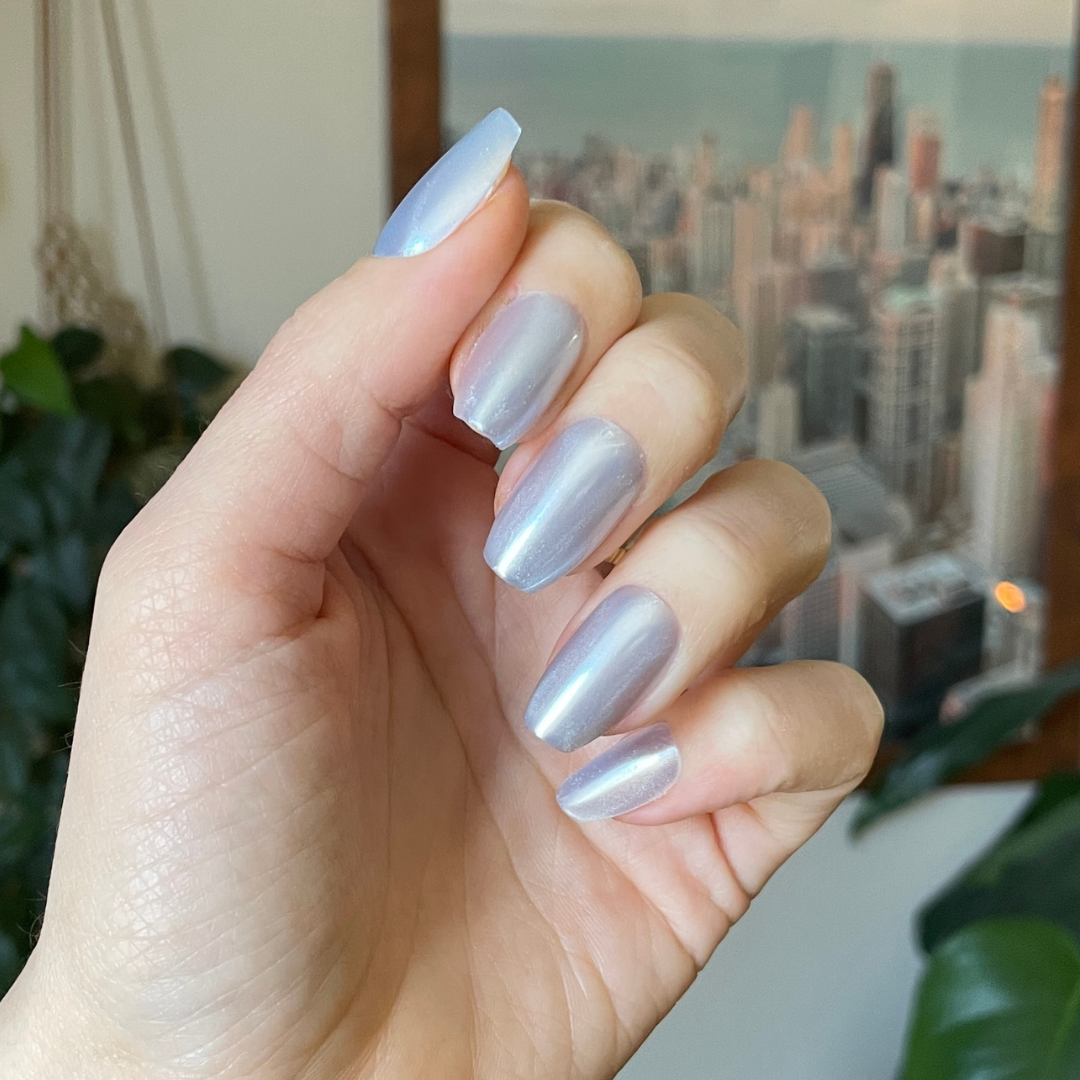 Blue Chrome - Press-On | Medium | Coffin showing a hand wearing pastel blue chrome medium coffin press-on nails indoors