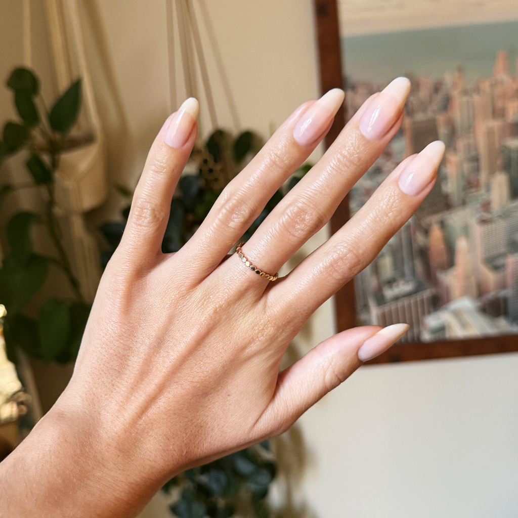 Blush Bounce - Builder Gel on elongated natural nails softly polished with a sheer blush pink gel manicure finish
