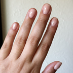 Blush Bounce - Builder Gel softly applied on short natural nails with a smooth sheer blush pink gel manicure finish