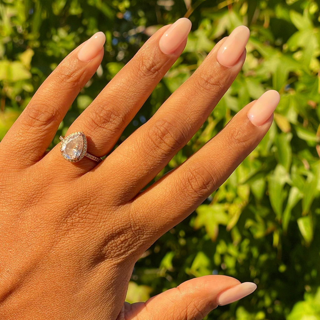 Blush Bounce - Builder Gel on natural nails with a smooth sheer blush pink manicure in natural sunlight outdoors