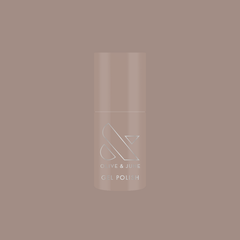 Bottle of AW - Gel polish in warm grey shade for chic, long-lasting manicure by Olive and June on muted background