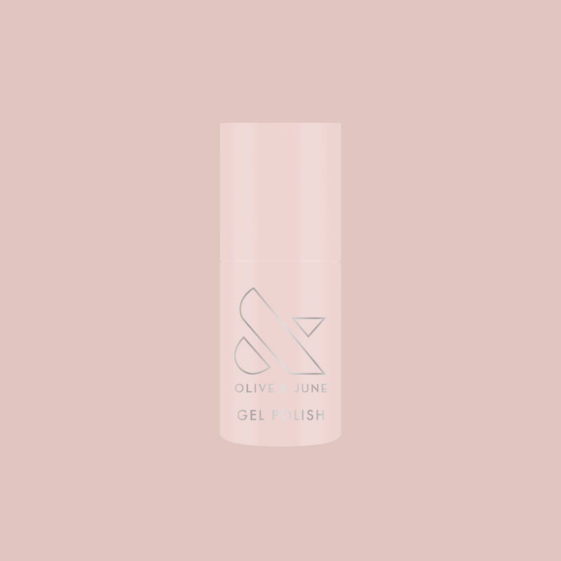 Olive and June Dream Job - Gel polish bottle in milky sheer pink on matching soft pink background