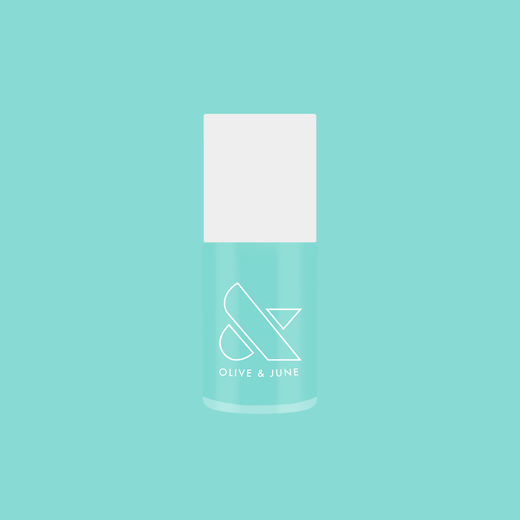 Slam Dunk nail polish bottle in true turquoise shade by Olive and June for vibrant at-home manicure.