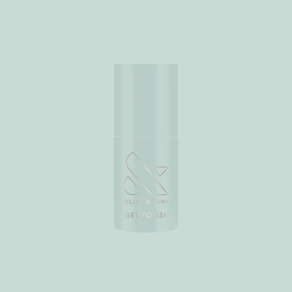 KMC - Gel bottle shown in sage green packaging on a matching background representing long-lasting gel polish by Olive and June