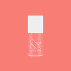 Olive and June Papaya Gloss sheer coral pink nail polish bottle against matching coral background for mani or pedicure