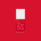 Olive and June Secret Recipe nail polish bottle in classic blue-toned red shade on red background