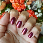 Budget? What Budget deep rose-orange duochrome polish on natural nails for a stunning manicure by Olive and June