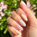 Neon Lines - Press-On | Medium | Almond showing neutral mani with colorful neon stripes on medium almond false nails outdoors