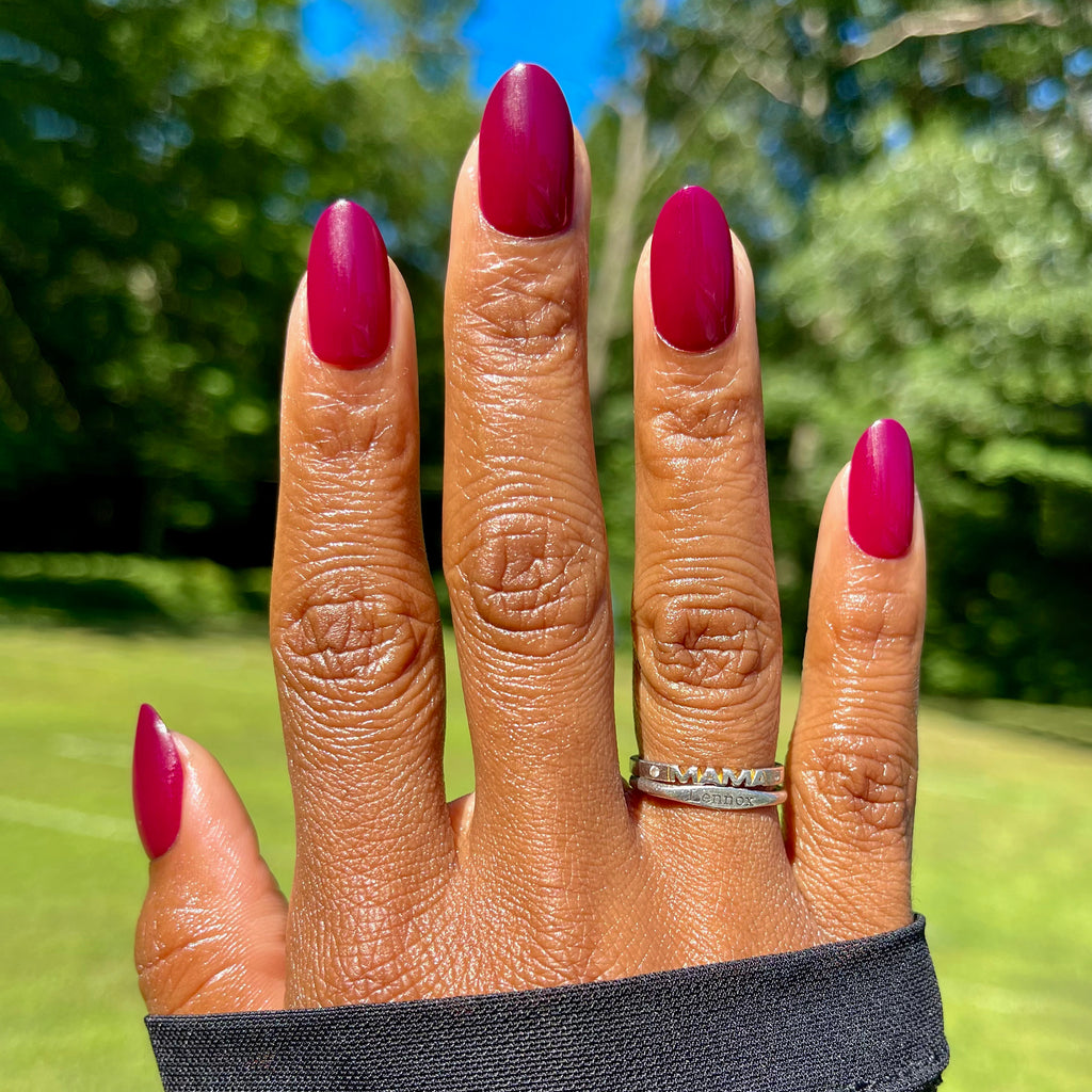 Cabernet | Medium | Oval - Tab Press-On showing medium oval nails in rich dark plummy red perfect for at home mani