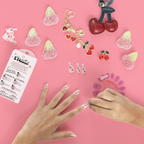 Cherry Whirl - Pressies | Short Medium | Round showing kid applying pink press on nails with cherry designs on pink background