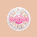 Confetti Sparkle - Press-On | Short | Round false nails with milky neutral base and starry gem sparkles for easy at-home mani