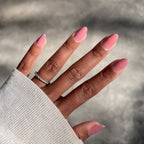 Hand with medium brown skin tone showing glossy Can I Borrow A Sweater? gel polish manicure in natural light