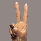 Hand with Dark Chocolate gel polish by Olive and June on medium-length rounded nails against plain background