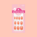 Frolic | Extra Short | Round - Tab Press-On nails in bright orangey coral shade for easy at-home mani application
