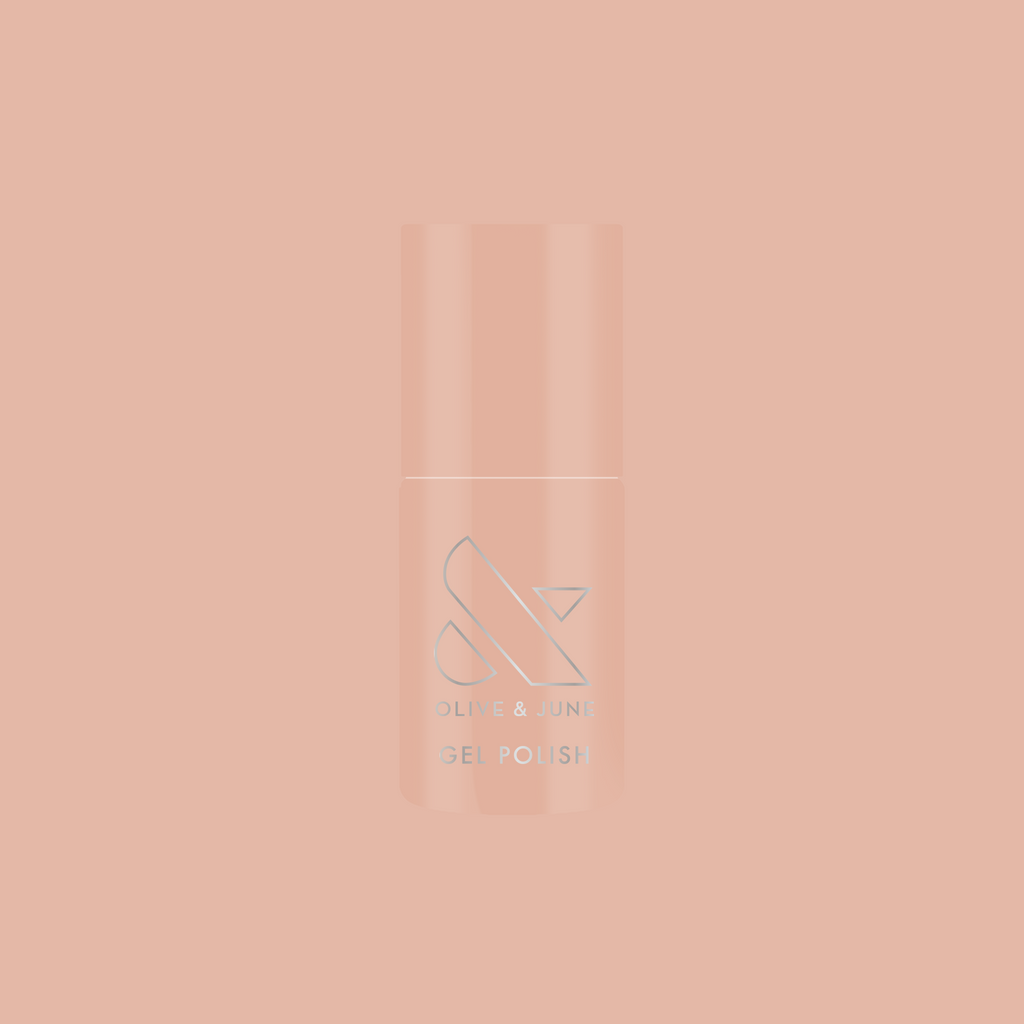 Bottle of KAG - Gel nail polish in neutral peachy pink shade on a matching soft peach background