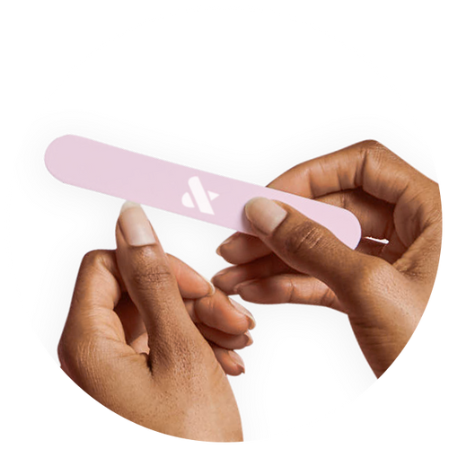 Hands with natural nails filing nails using a light pink nail file with logo on white background
