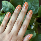 Glazed Pumpkin - Press-On | Short | Squoval short nails in shimmering pumpkin orange with chrome finish for at home manicure