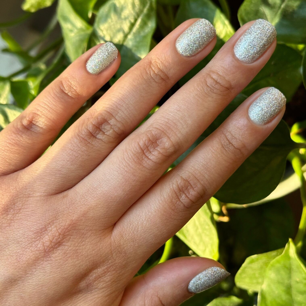 Glitter Department ultra fine holographic silver polish on natural nails for a sparkling mani by Olive and June