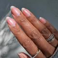 The Golden Effect Top Coat on natural nails adding a subtle golden shimmer for a luminous long-lasting manicure look thumbnail