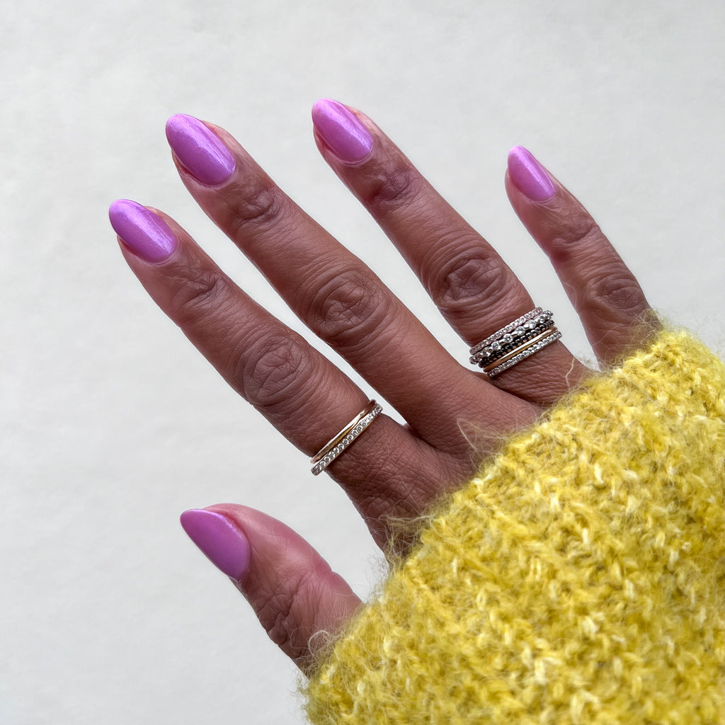 Island Time gel polish on natural nails in a subtle lilac shimmer for a smooth, long-lasting at-home manicure by Olive and June
