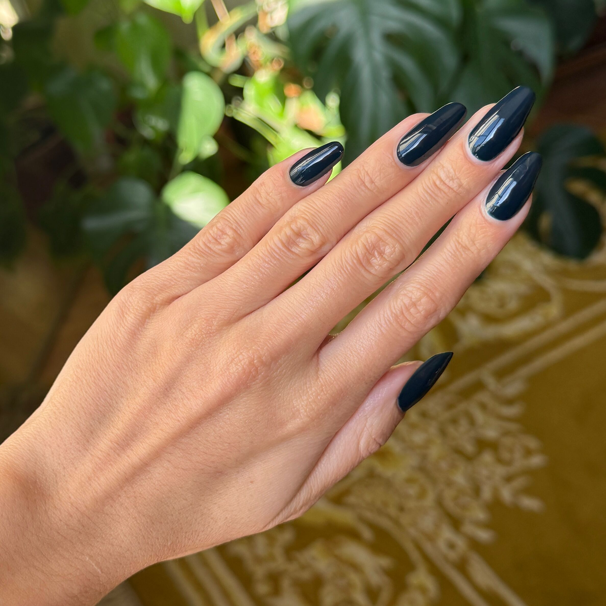 I'm Just Looking ultra deep teal gel polish on almond-shaped nails for a glossy at home manicure